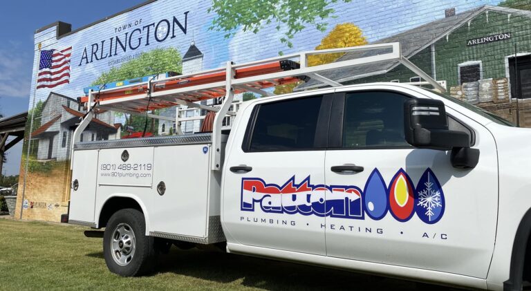 Patton Plumbing Truck in front of painted Arlington Town